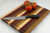 Gestreiftes Schneidebrett mit Streifen aus Ahorn, Walnuss, Padauk und Kirsche